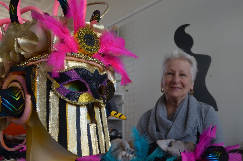 Warwick artist Juanita Faint with a headpiece from one of her four creations for the Fashionarty event. 